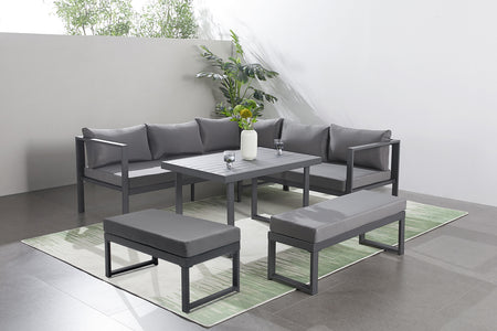 Salon de jardin gris foncé 7 places canapé et bancs Marbella photo d'ambiance